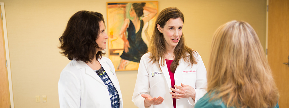 Dr. Emmanuelle Paré and Dr. Abigail Khan talk with a patient at the OHSU Center for Women’s Health.