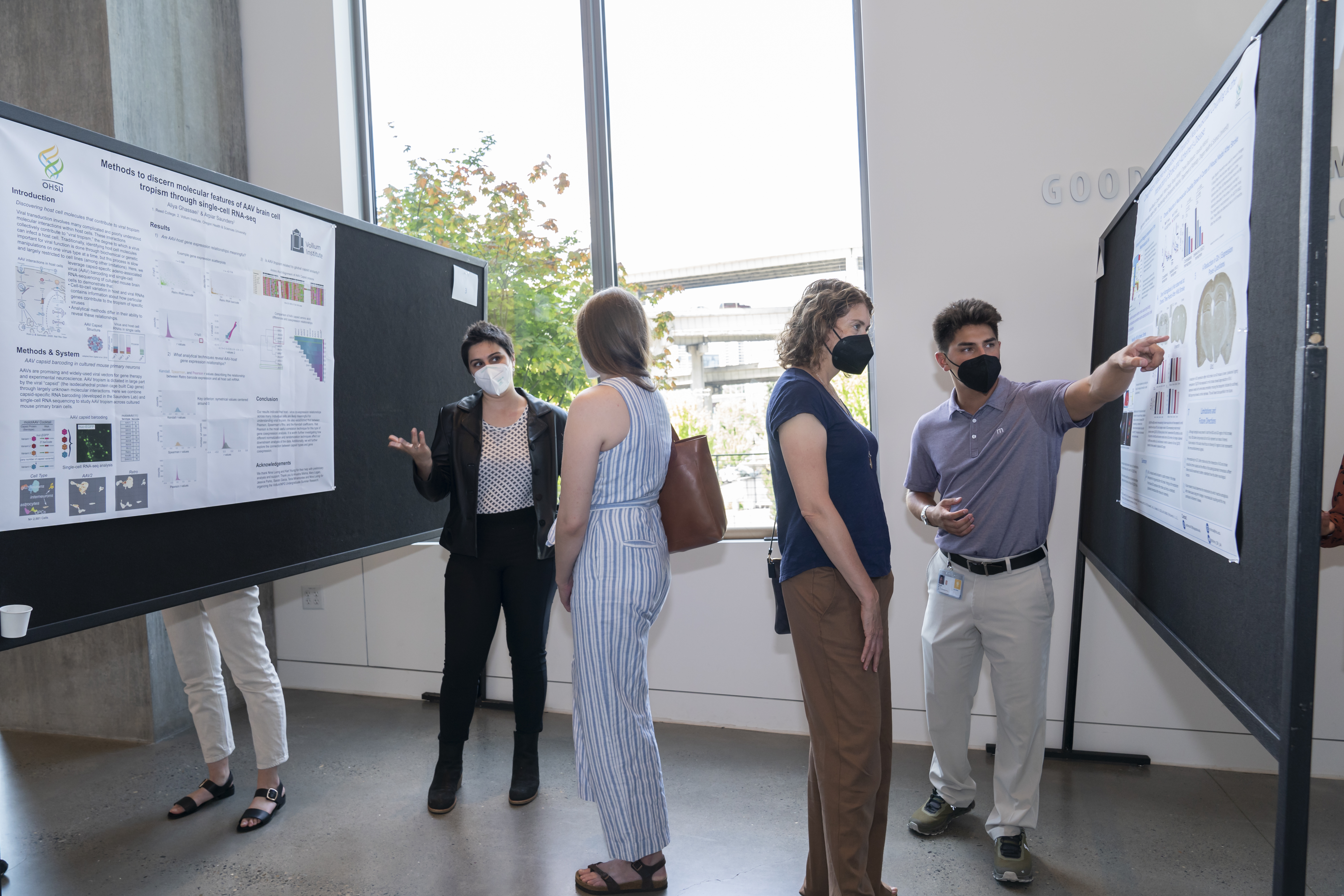 Summer interns, Aliya and Jacob, present their summer research during the poster symposium.