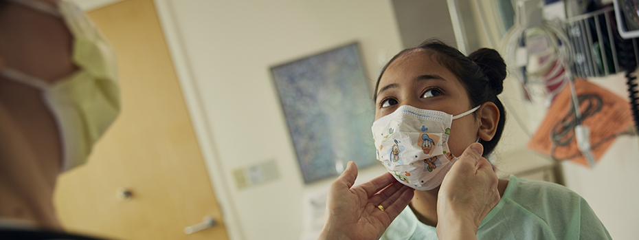 Dr. Monique Bohun, pediatric cardiologist, examines a patient.