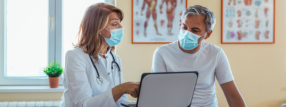 A doctor chats with her patient during a virtual visit with a specialist.