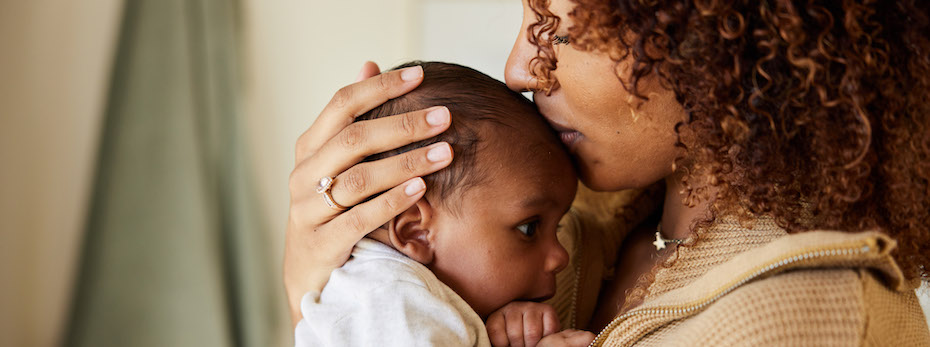 A mother holding her baby