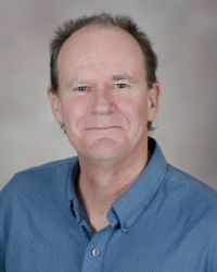 Professional portrait of Dr. Clive Woffendin, Lab Manager for the Clinical and Translational Research Center at the Oregon Clinical and Translational Research Institute.