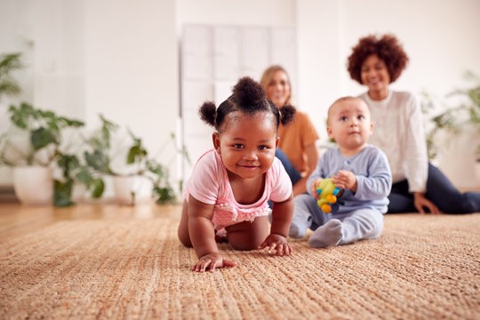 Image of two adults and two babies