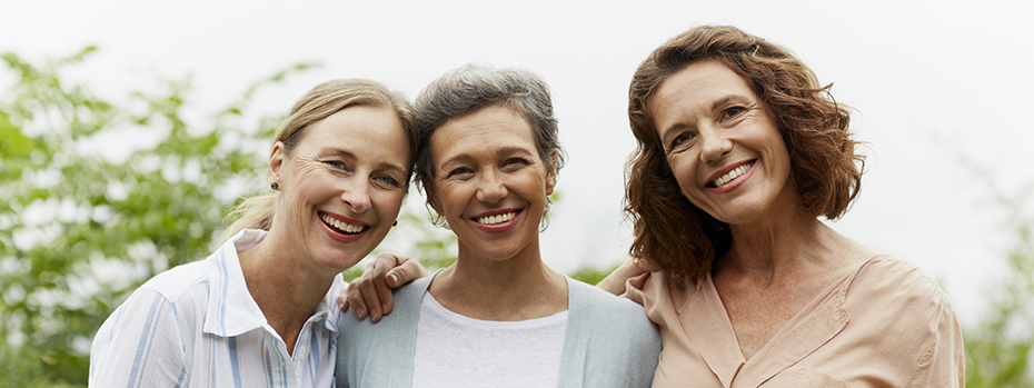 Three women, joyful to be well, together.