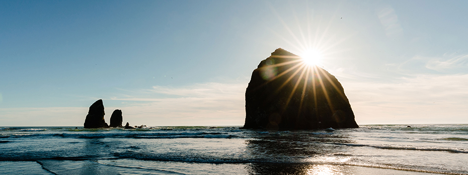 A photo of Haystack Rock at Cannon Beach, Oregon at sunset.