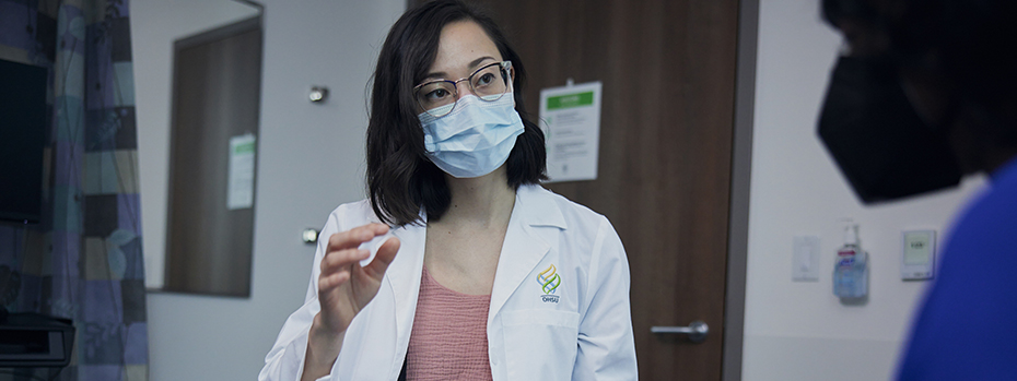 Dr. Wong talks with a patient at the OHSU Center for Women’s Health.