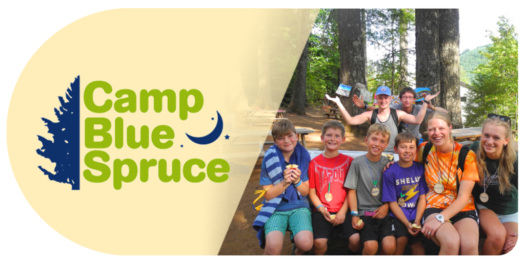 Children pose for a picture at camp blue spruce 