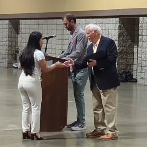 Incoming APS President Rick Sampson presents April with her award for Undergraduate Abstract of Excellence.