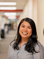 A photo of Joanna Galindo standing in a clinic hallway.