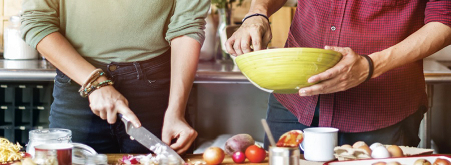 A couple making a meal in the kitchen.