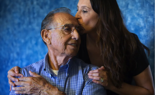 Maria Smythe gives her father, Leo Cruz, a kiss in his Yakima home. Smythe is a kidney donor who wanted to donate to her father, but the pair were not a match. 
