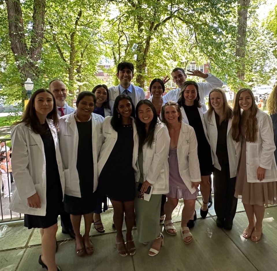 Group of incoming MD/MPH students in their white coats
