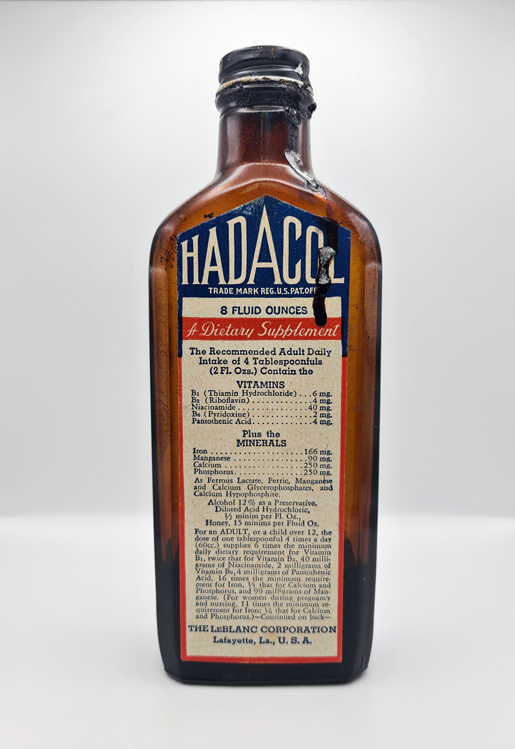 A brown bottle with a label "Hadacol" 