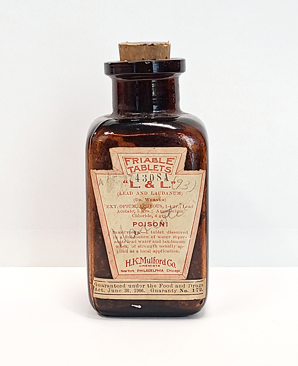 A dark amber bottle bears a label for "L & L Friable Tablets"
