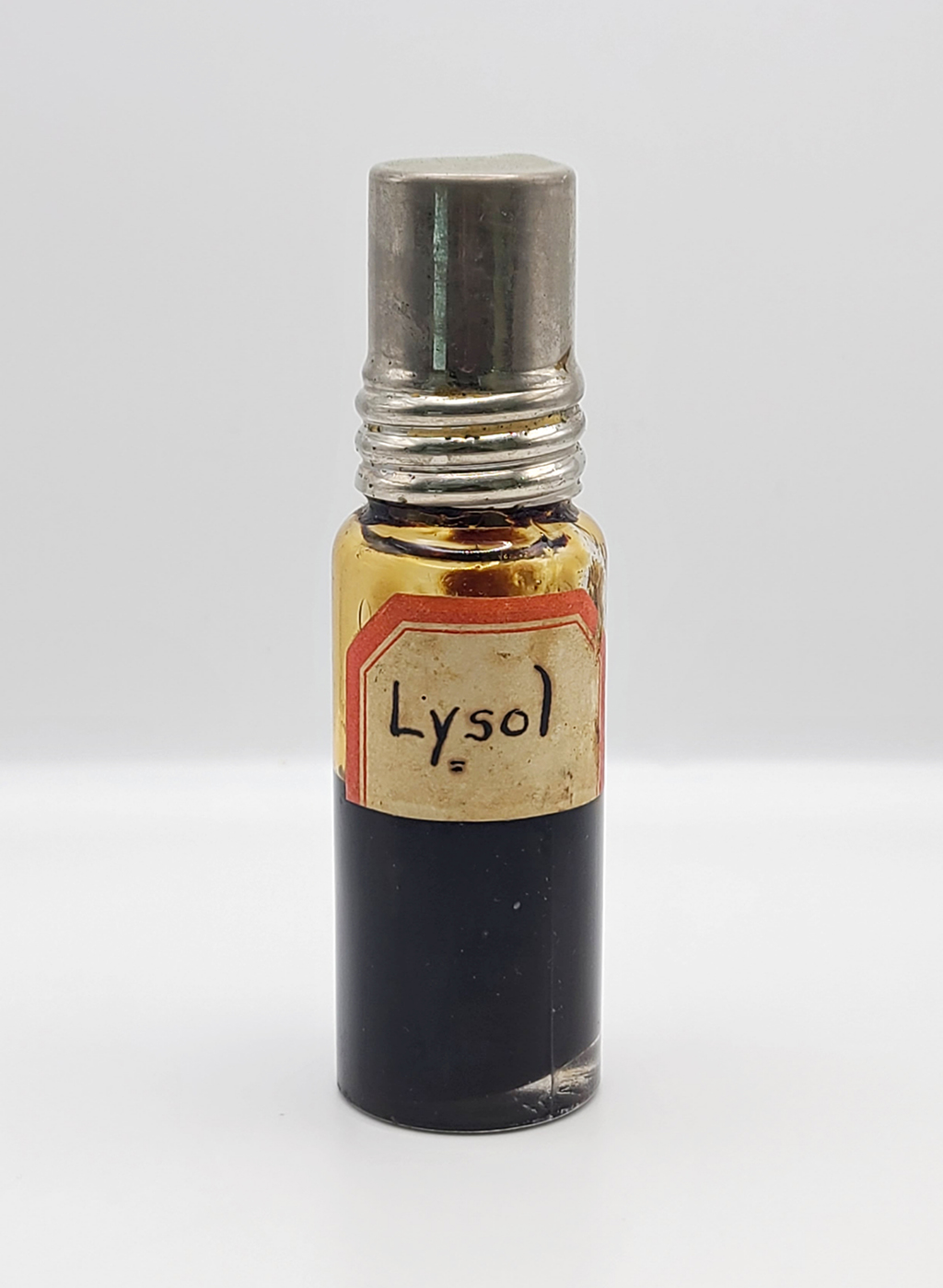 Dark bottle contains handwritten label for "Lysol"