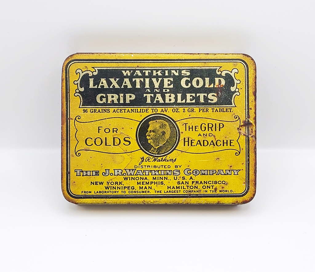 Yellow box displays the label "Watkin's Laxative Cold and Grip Tablets