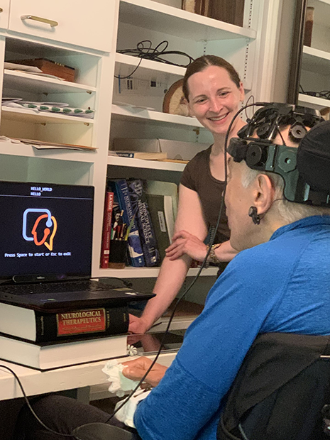 Doctor Richard Rosenbaum, who experiences ALS, testing the Brain-Computer Interface system with Dr. Betts Peters. 