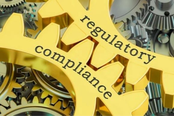 Graphic of cog wheel for regulatory and compliance workshop