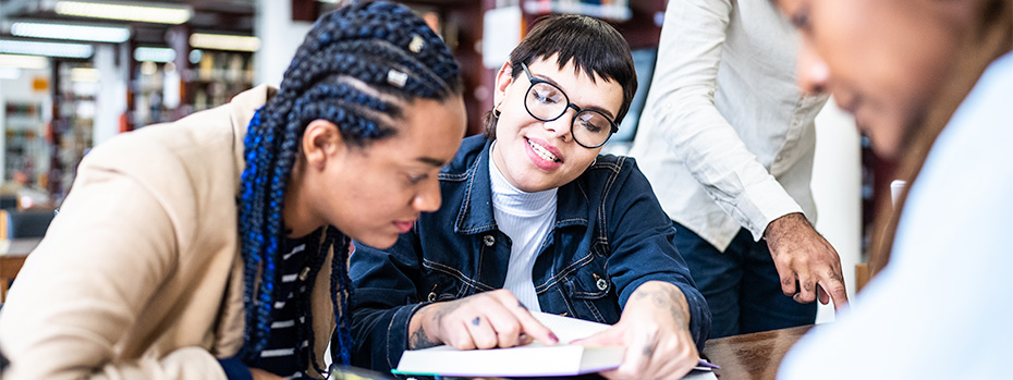 A student receives tutoring support.