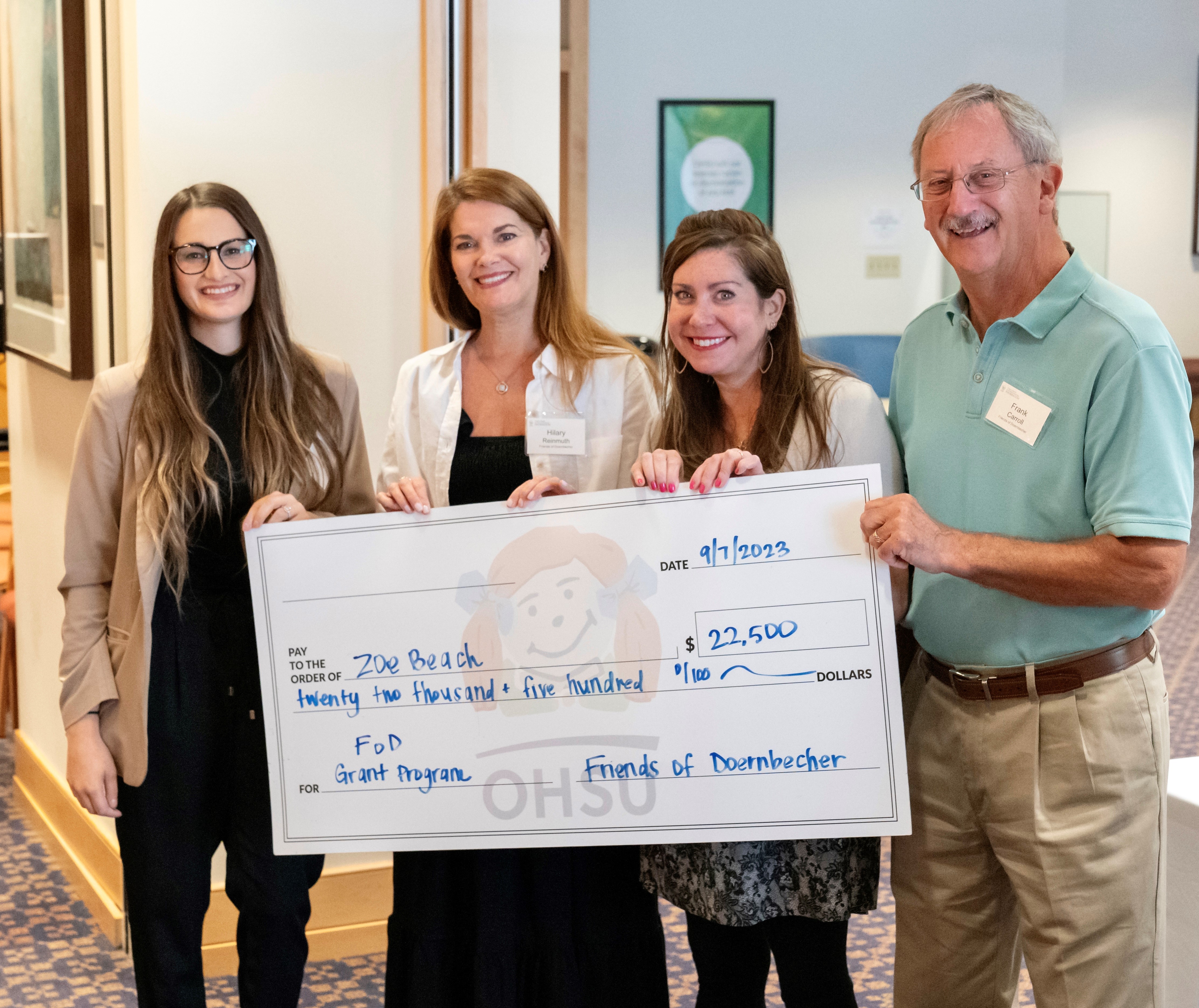 Zoe Beach (far left) is an MD/PhD student being awarded grant funding ffrom the Friends of Doernbecher for her project, “Evaluating Efficacy of Targeted Therapies in PDGFRA Altered Pediatric Brain Tumors".
