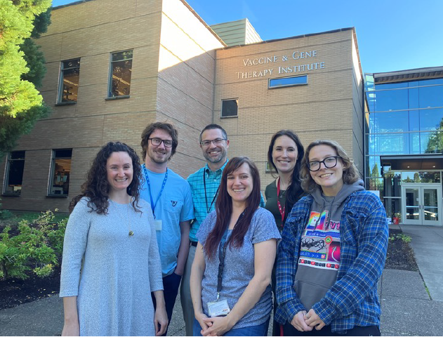 The six members of our team standing in front of the Vaccine and Gene Therapy Institute