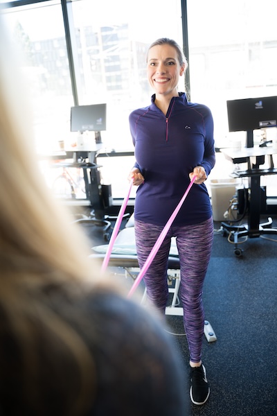 Physical therapists work with patients in well-equipped facilities.
