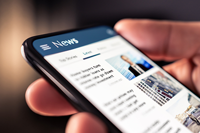 News online in phone. Reading newspaper from website. Digital publication and magazine mockup. Press feed with latest headlines in digital web portal. Reader watching media website in smartphone.