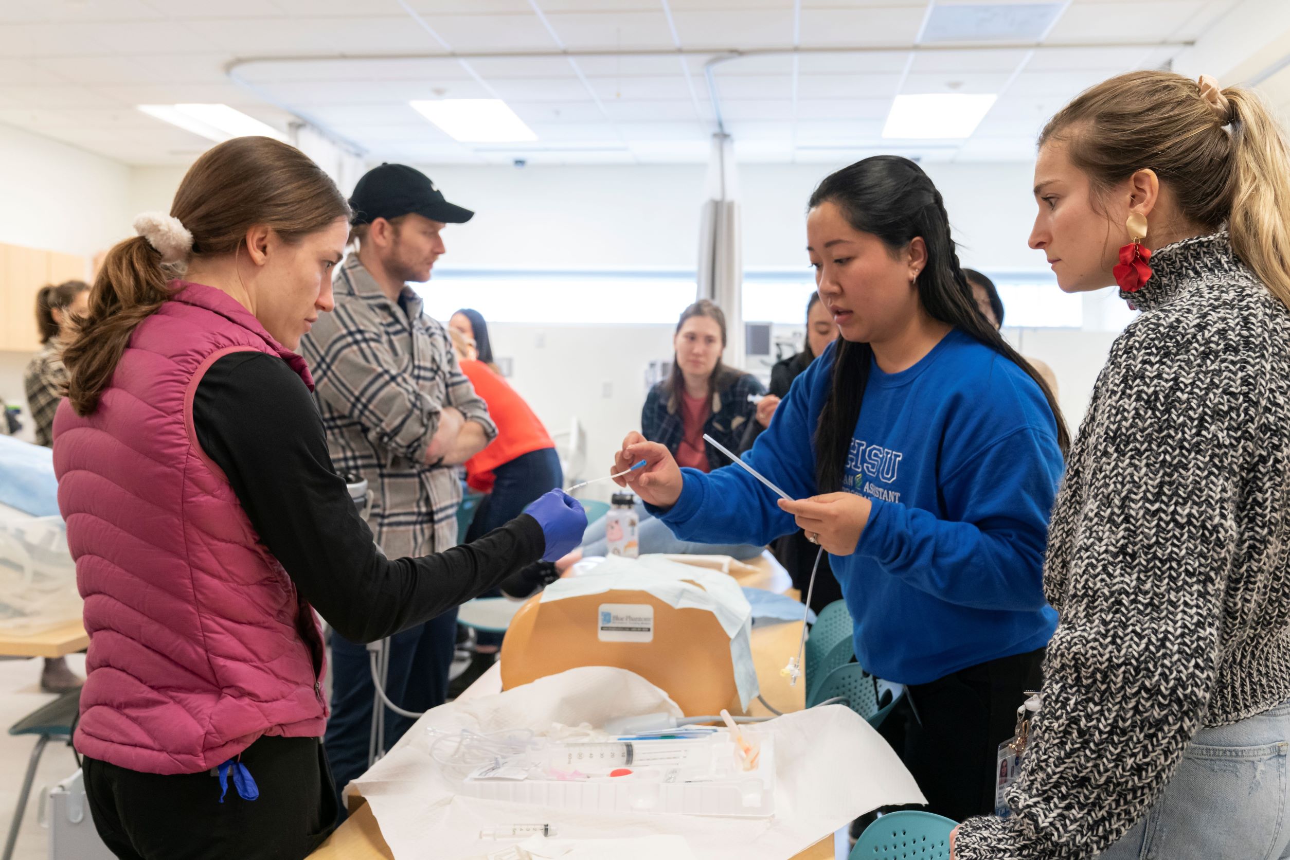 Students learning clinical skills in the simulation center