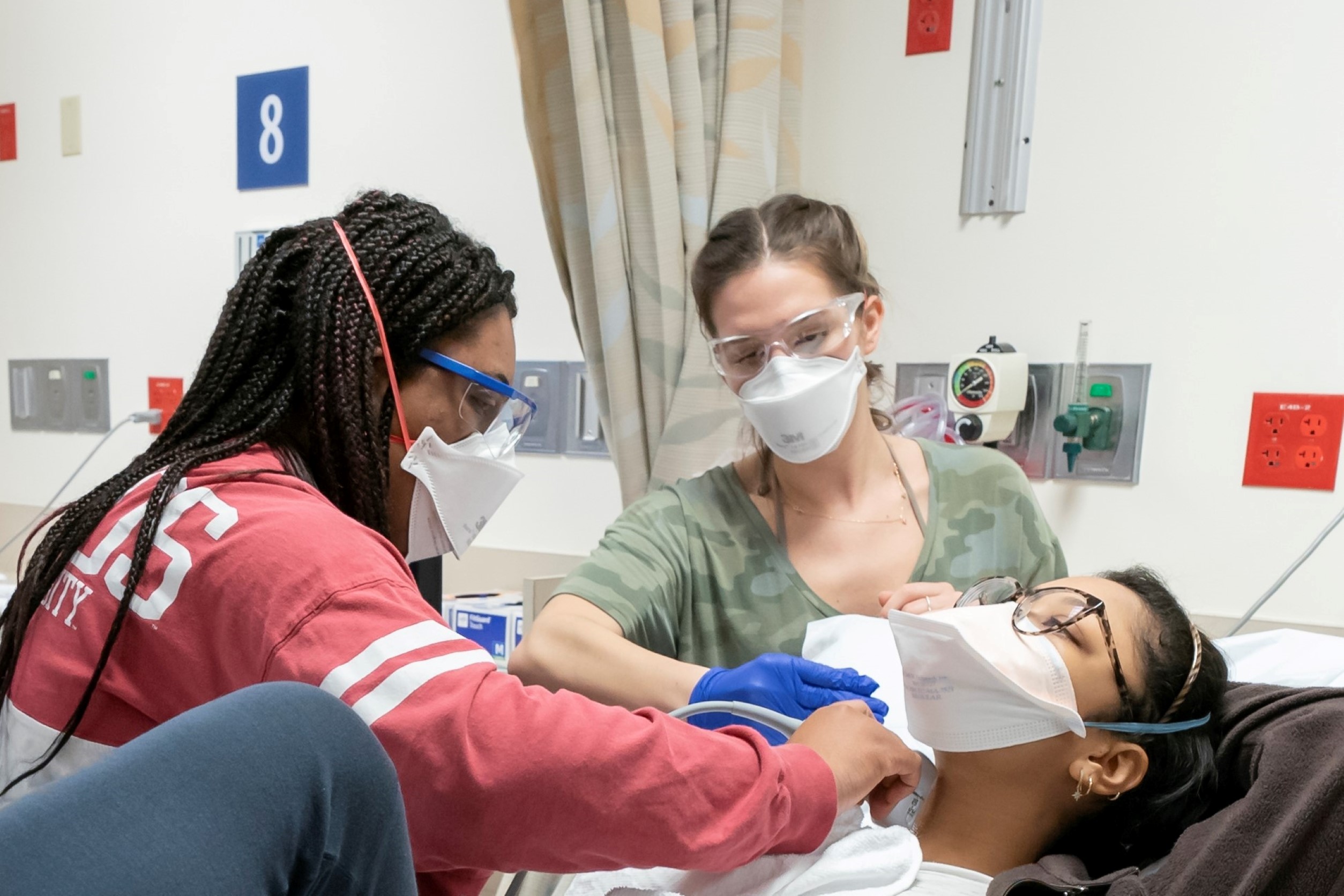 Students practicing clinical skills in the simulation center