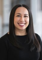 Headshot of smiling woman with dark hair