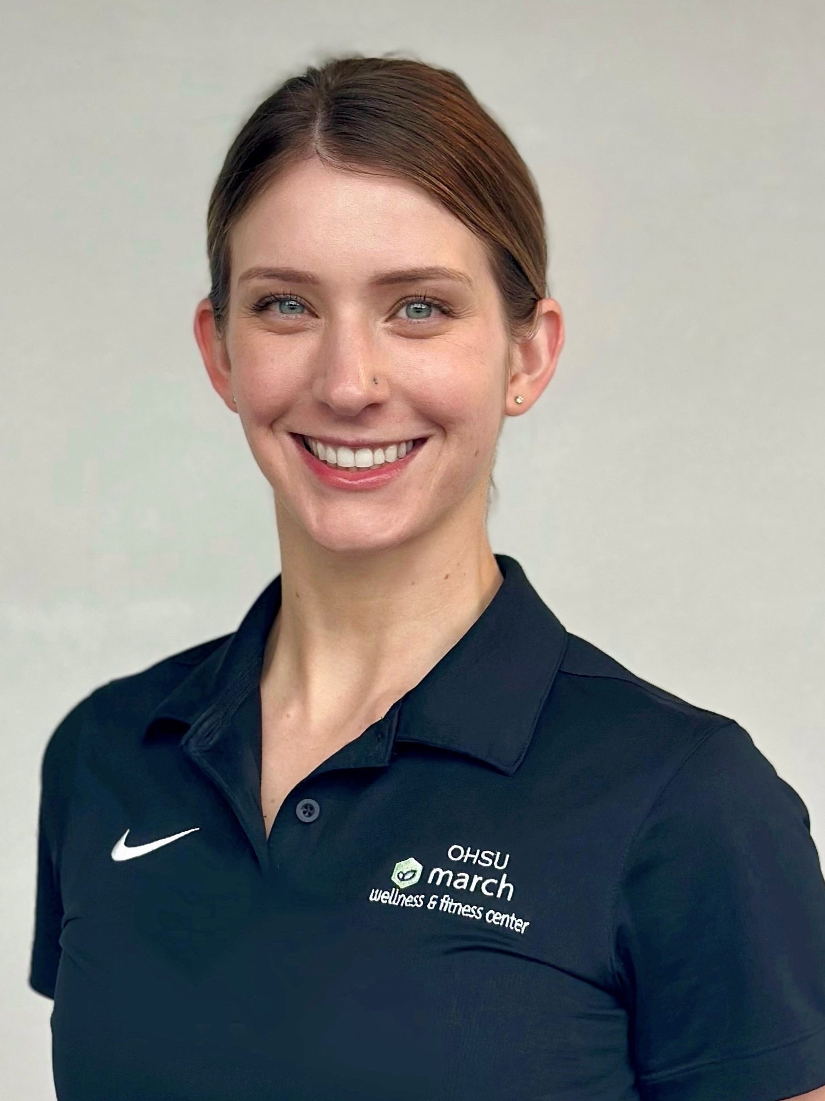 Picture of Maya Brewer with dark march wellness polo shirt