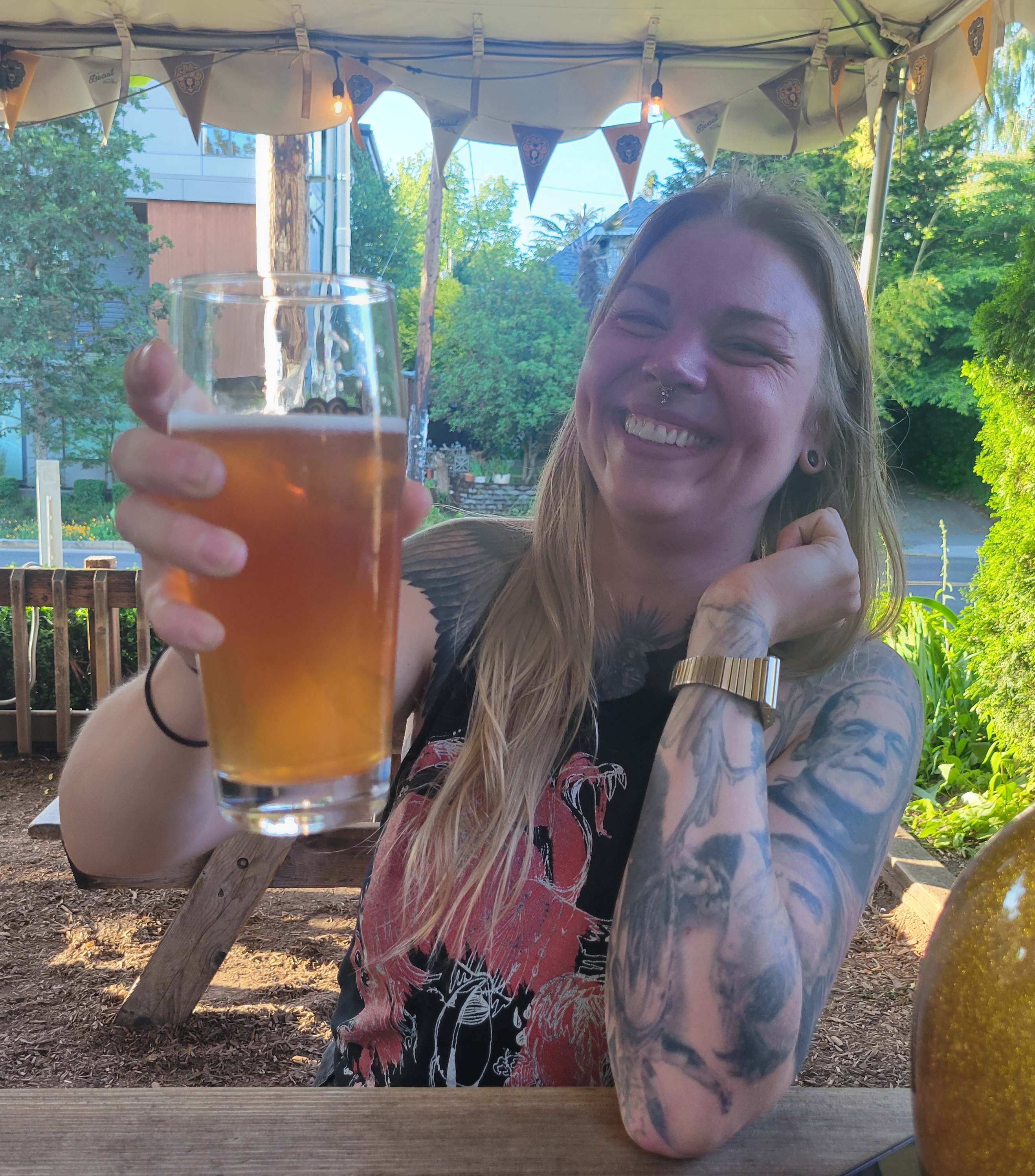 Rachael cheering with a drink