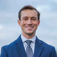 Headshot of Alex Tomlinson