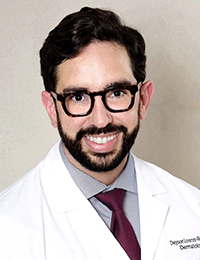 Dr. Lorenzo Rios smiles for a portrait