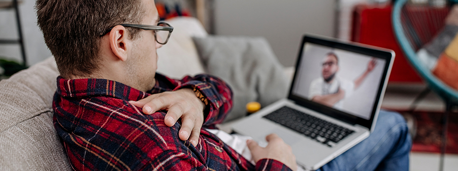 A patient doing a video visit from his couch