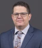 Professional portrait of Jonathan Jubera, OCTRI Senior Project Manager of Biomedical Innovation Program.