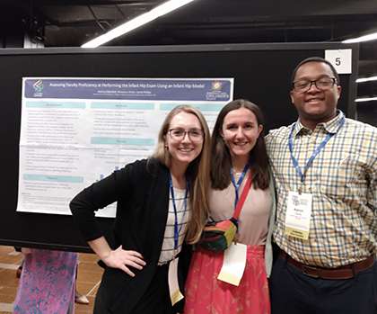 Presentation poster with presenters