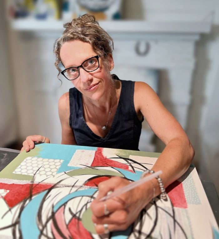 Picture of Betsy Bustamonte creating a painting