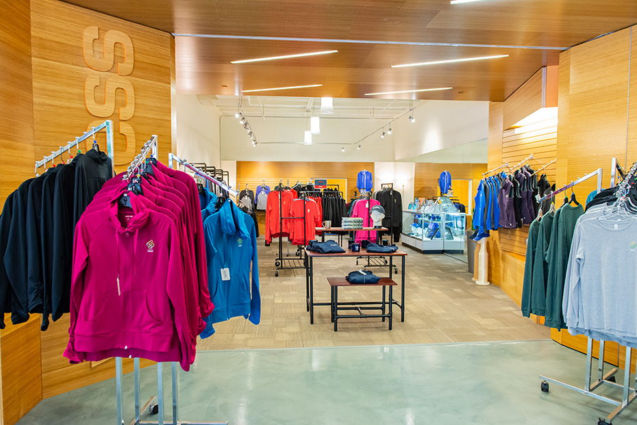 Racks of OHSU apparel on display at the campus store.