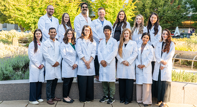 A group of dermatology residents pose for a picture