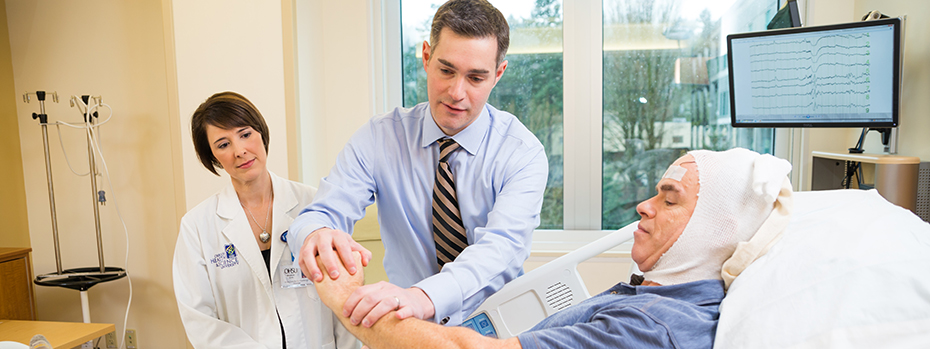 Anjalee Rowe and Dr. Motika treat a patient in OHSU’s epilepsy monitoring unit.