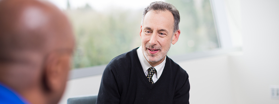 Dr. Jeffrey Kaye, an expert on aging, Alzheimer’s and other dementias, consults with a patient at OHSU