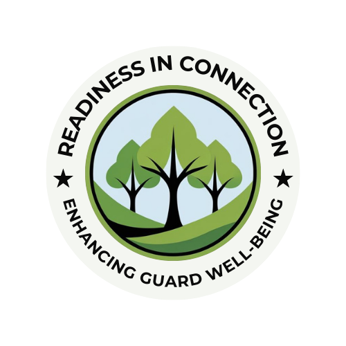 Circular logo for Readiness in Connection on a black background. The outer ring reads "READINESS IN CONNECTION" along the top and "ENHANCING GUARD WELL-BEING" along the bottom, separated by two black stars. The inner circle features an illustration of three green trees on a rolling green hill against a light blue sky.
