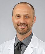 A professional headshot of Dr. Duncan Ramsey.