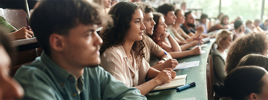 Students taking notes in class.