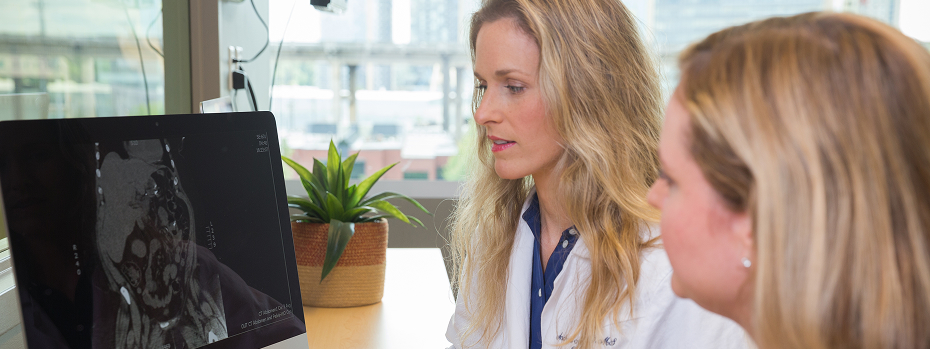 Dr. Andrea Stroud (left), a bariatric surgeon at OHSU, reviews images on a computer with Stefanie Collier, RN.