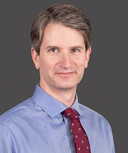 Dr. Noah Hornick smiles for a portrait photo