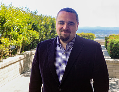 Ahmad Masri, M.D., M.S.,  stands outside at OHSU