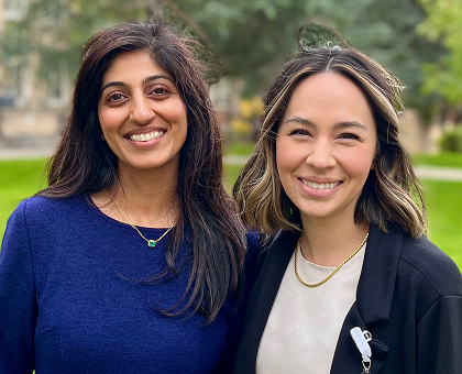 Portrait of surgical data scientists Dr. Ruchi Thanawala and Dr. Julie Doberne outside smiling at the camera.