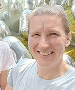 Photo shows Kristen Jones smiling outdoors.